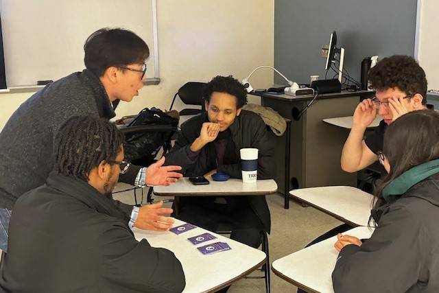 Group of students from educators of color network studying together